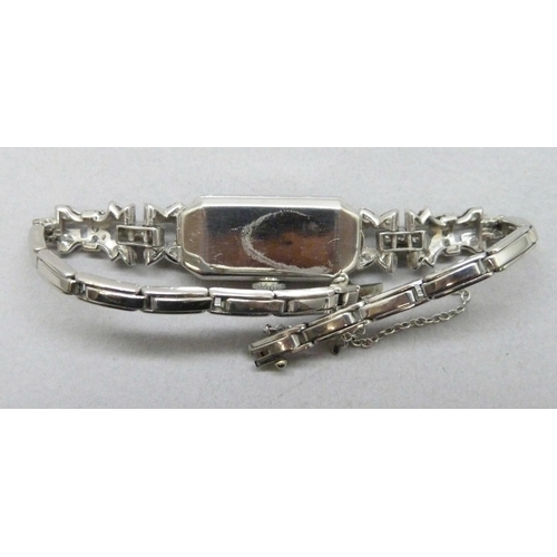 7309 - A lady's Art Deco platinum cocktail wristwatch set with diamonds, 19.5g total including movement, 13... 