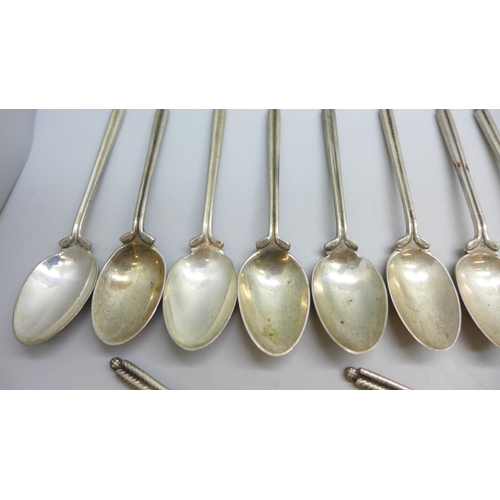7340 - A set of twenty three silver golf spoons, mainly by Walker & Hall, different years, 270g