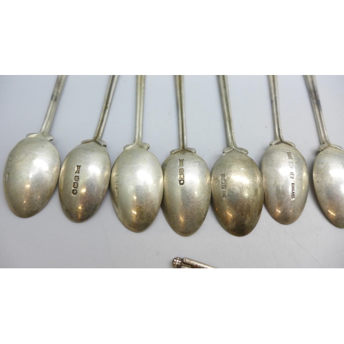7340 - A set of twenty three silver golf spoons, mainly by Walker & Hall, different years, 270g