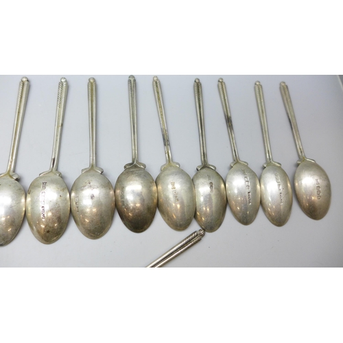 7340 - A set of twenty three silver golf spoons, mainly by Walker & Hall, different years, 270g