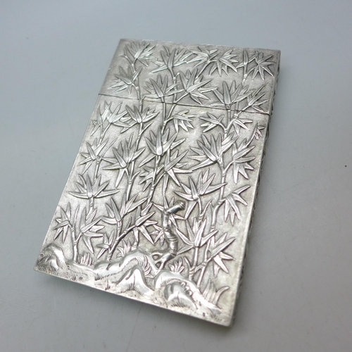 7351 - A Chinese embossed silver card case, control marks to base, 81g, 10.5 x 7.2cm