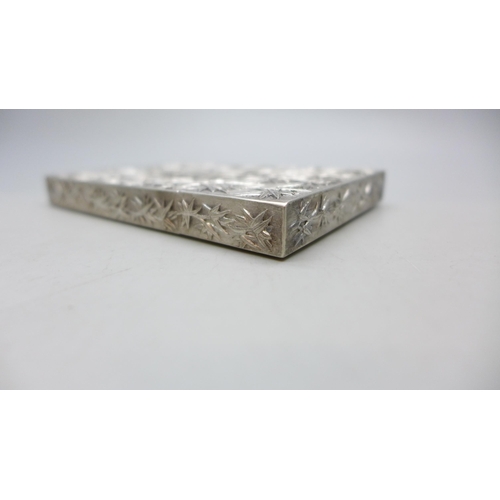 7351 - A Chinese embossed silver card case, control marks to base, 81g, 10.5 x 7.2cm