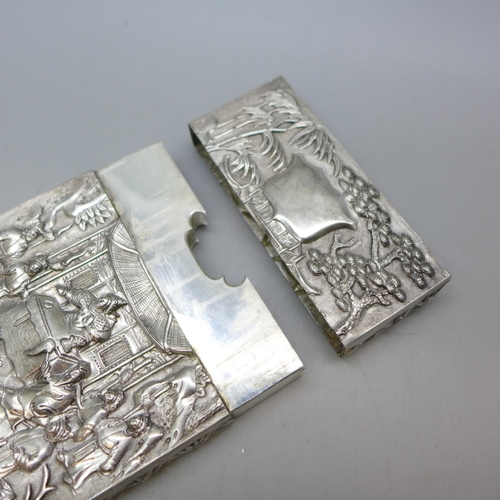 7351 - A Chinese embossed silver card case, control marks to base, 81g, 10.5 x 7.2cm