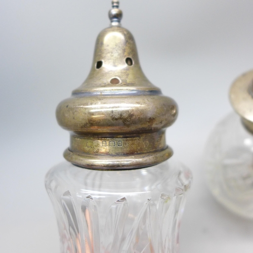 7358 - A cut glass sugar caster with a silver top, silver 18g, and a scent bottle with silver top, a/f