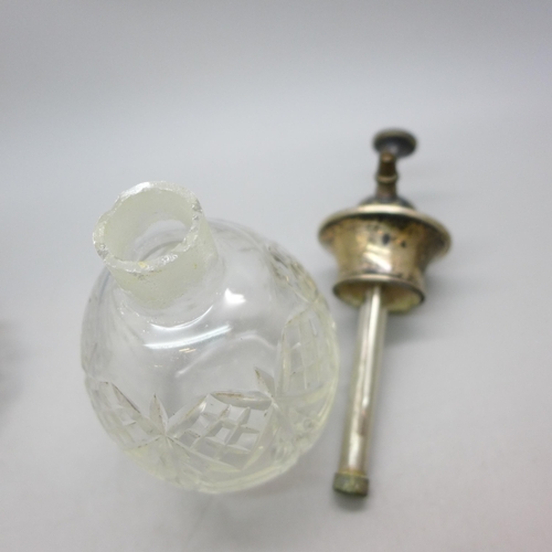 7358 - A cut glass sugar caster with a silver top, silver 18g, and a scent bottle with silver top, a/f