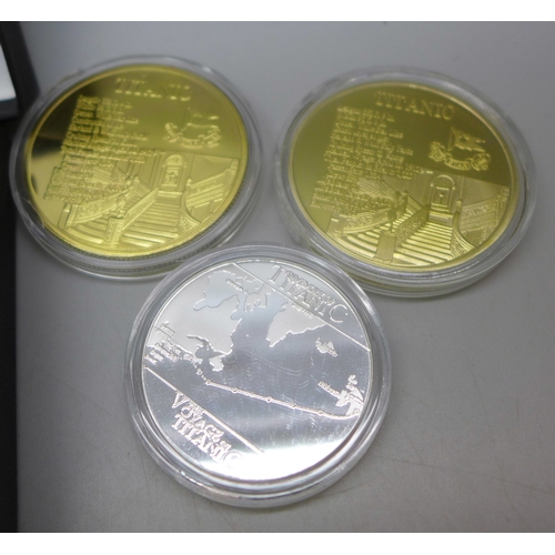 7330 - Coins - The Titanic, a set of five medallions in colour, gold, silver and blue, each medal shows the... 