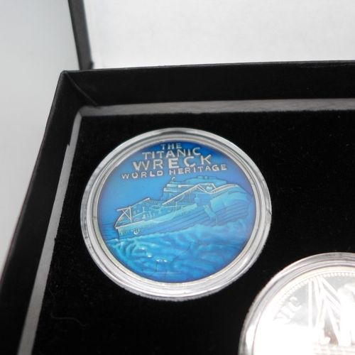 7330 - Coins - The Titanic, a set of five medallions in colour, gold, silver and blue, each medal shows the... 
