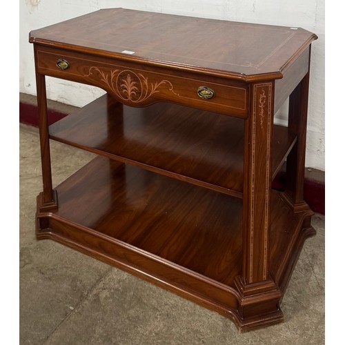 117 - A French style inlaid mahogany three tier whatnot