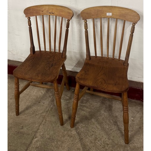 137 - A pair of Victorian elm and beech kitchen chairs