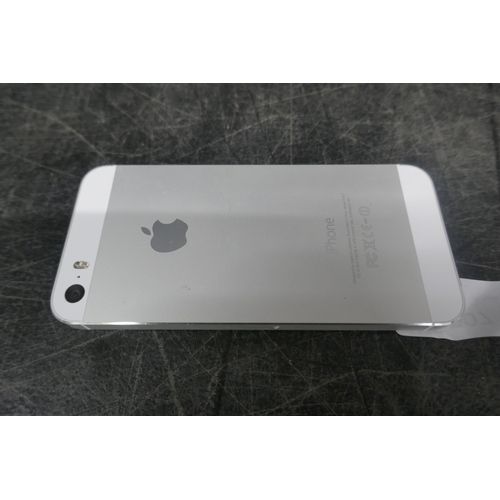 5007 - An apple iphone 5s with charging cable and a nokia mobile phone