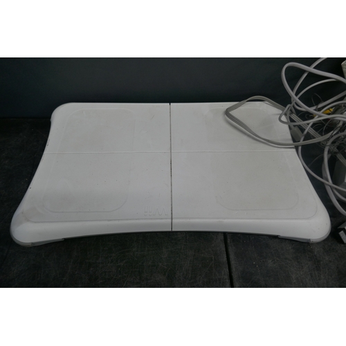 5019 - A Nintendo Wii games console with base, power supply, sensor bar and AV cables - no remotes  * This ... 