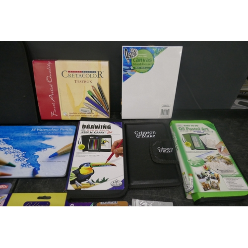 5033 - A collection of artists materials and tools including practice paper pad, sketchpad, pencils, pastel... 
