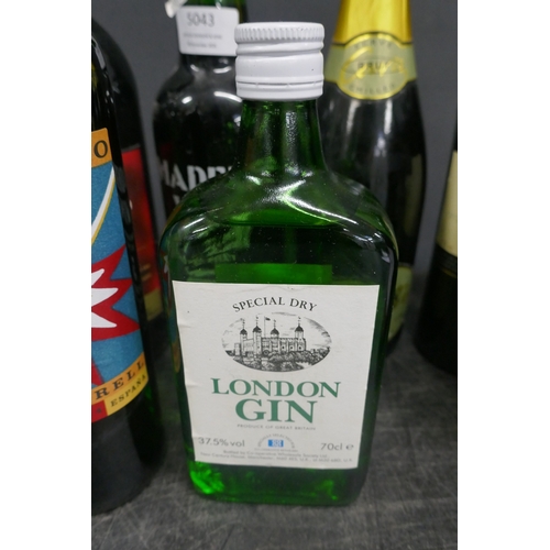 5043 - A quantity of assorted alcohol including Gordon's, London Gin, French Revolution, etc.