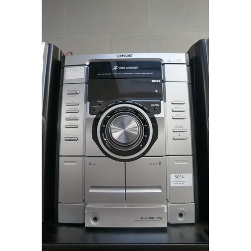 5054 - A Sony HCD-RG270 compact disc deck receiver with 3-disc changer, double cassette deck and radio with... 