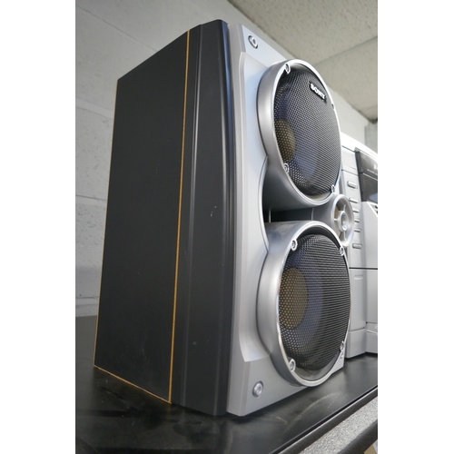 5054 - A Sony HCD-RG270 compact disc deck receiver with 3-disc changer, double cassette deck and radio with... 