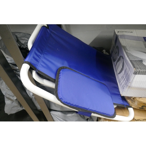 5064 - A quantity of assorted disability aid items including toilet seats, overbed table, bathroom stool, e... 