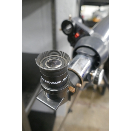 5068 - A Celestron Astromaster LT80AZ telescope on tripod