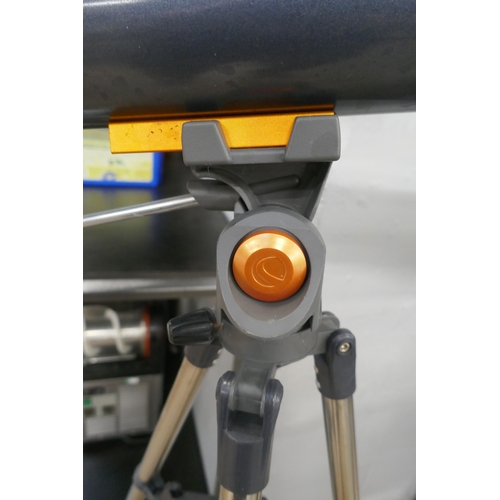 5068 - A Celestron Astromaster LT80AZ telescope on tripod