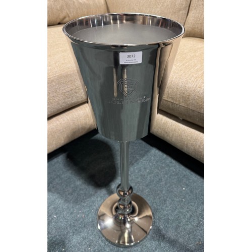 3165 - A silver effect floor standing champagne holder