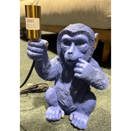 3179 - A blue monkey table lamp