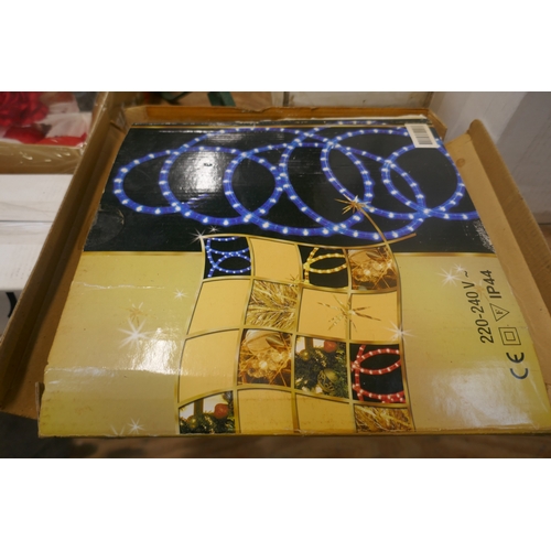 5117 - A large quantity of Christmas items including string lights, glow up moose, glow up snowman, tree ba... 