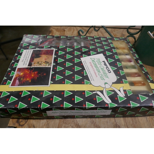 5117 - A large quantity of Christmas items including string lights, glow up moose, glow up snowman, tree ba... 