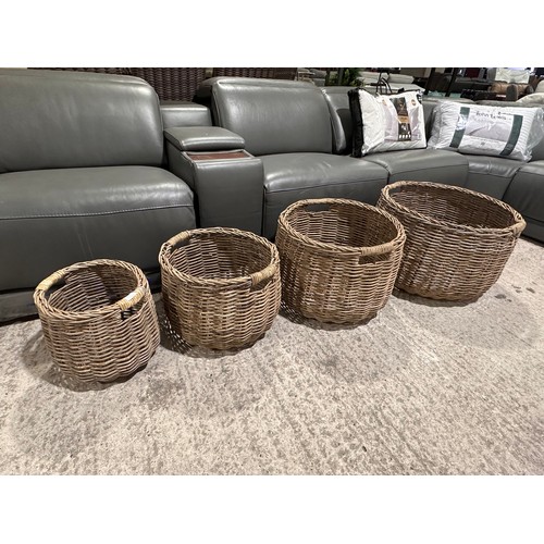 3208 - A set of four circular wicker storage baskets