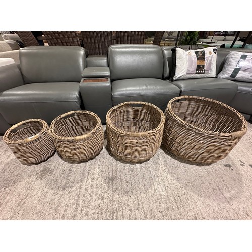 3208 - A set of four circular wicker storage baskets