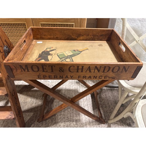 3234 - A rustic painted champagne tray on stand bearing Moet and Chandon inscription
