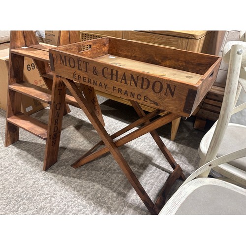3234 - A rustic painted champagne tray on stand bearing Moet and Chandon inscription