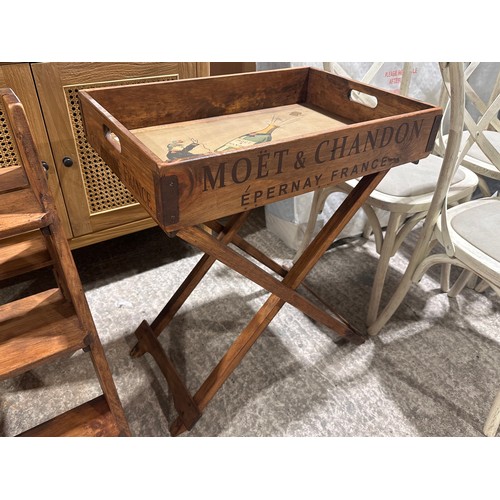 3234 - A rustic painted champagne tray on stand bearing Moet and Chandon inscription