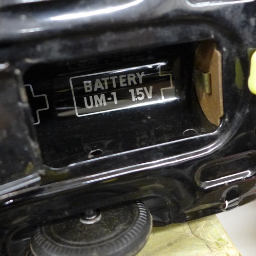 2059 - Three battery operated model cars, John Player Special, a Japan made Highway Patrol Car and Speed Bu... 