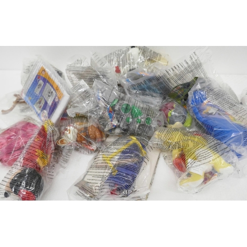 2284 - A large collection of McDonald's Happy Meal Toys, to include Snoopy, Minnie Mouse, Disney examples, ... 