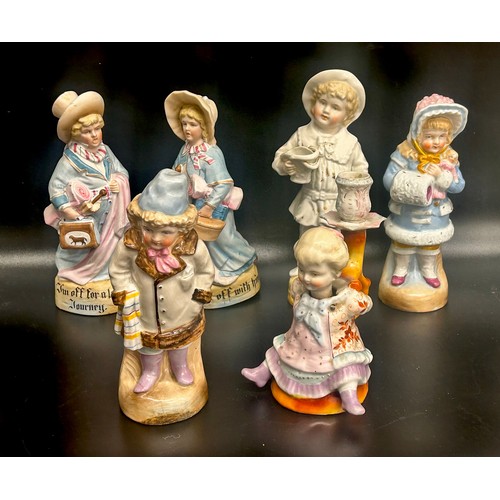 2266 - A collection of German figures to include a pair of bisque porcelain lady and gentleman with luggage... 