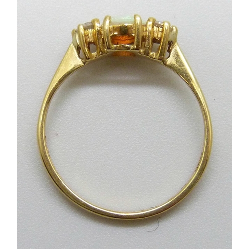 7123 - An 18ct gold, opal and diamond ring, 1.9g, L
