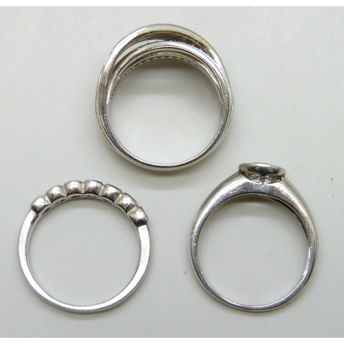 7128 - Three silver rings, 15g total