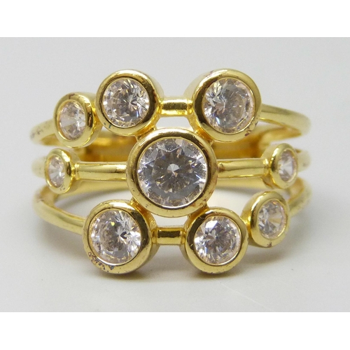 7137 - A silver gilt ring set with white cubic zirconia stones, S