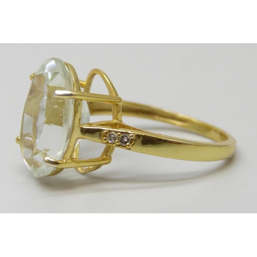 7138 - A silver gilt ring set with a pale green stone, N/O