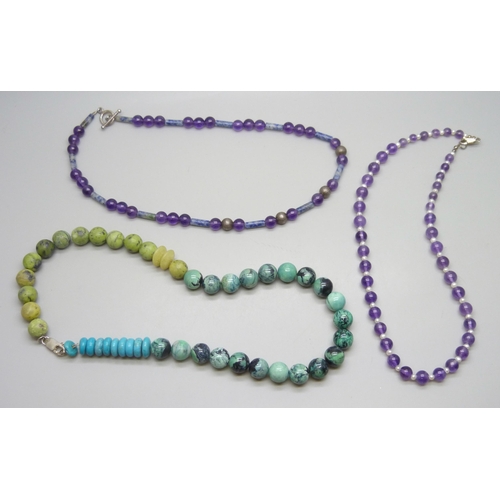 7146 - Two amethyst necklaces with silver clasps, including an example set with pearls, 60g, together with ... 