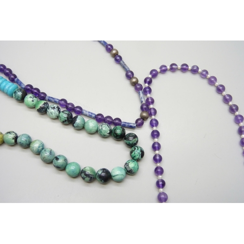 7146 - Two amethyst necklaces with silver clasps, including an example set with pearls, 60g, together with ... 