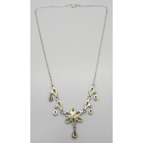 7149 - A silver and peridot gemstone drop necklace, 43cm