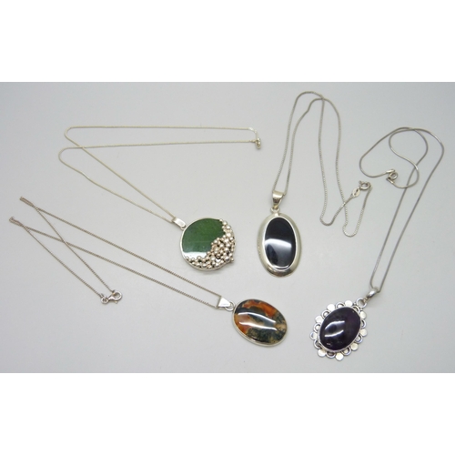 7156 - Four silver stone set pendants and chains including a nephrite example and moss agate, 52g