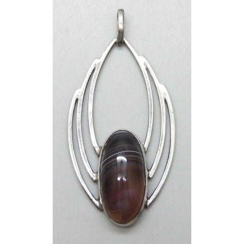 7160 - A Scottish white metal and agate brooch, attributed to Ola Gorie, tests as silver, 5.3cm including b... 