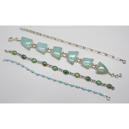 7161 - Four silver bracelets including a dried flower example, 54g