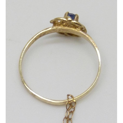 7171 - A small gold ring on a 9ct gold chain, 0.7g total