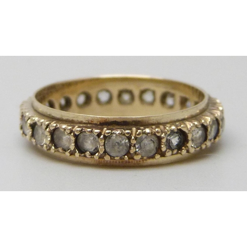 7173 - A 9ct gold spinel set eternity ring, 2.2g, L