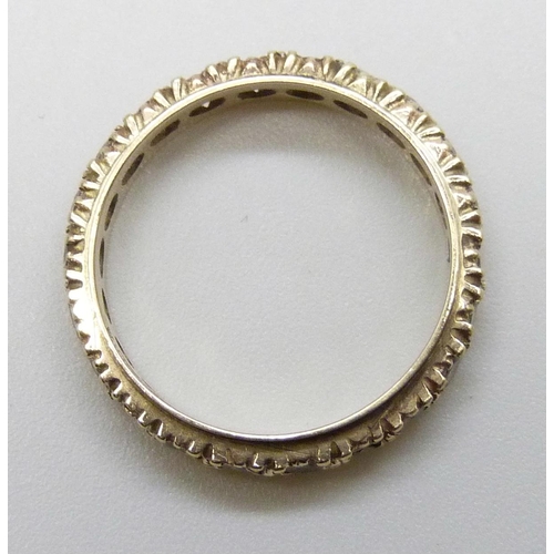 7173 - A 9ct gold spinel set eternity ring, 2.2g, L