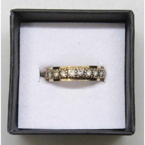 7173 - A 9ct gold spinel set eternity ring, 2.2g, L