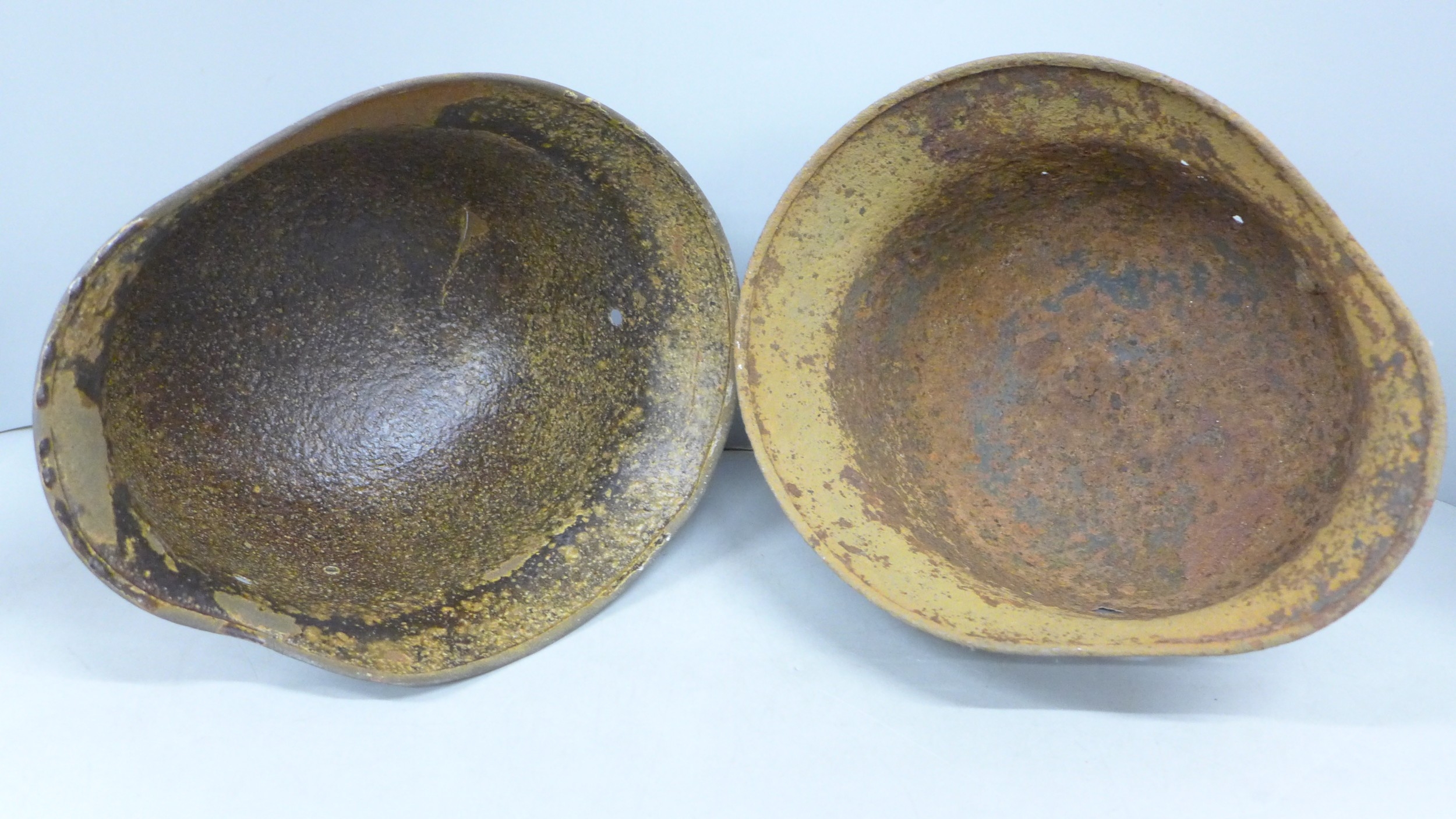 Two German WWII M40 relic helmet shells