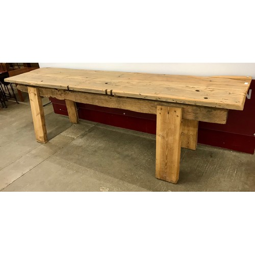 87 - A large rustic pine refectory table